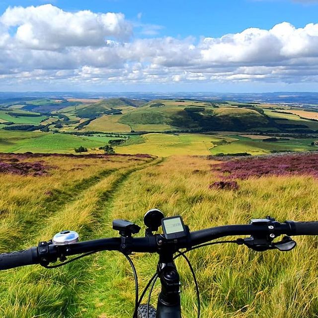 A picture of a go electric hire bike overlooking the cheviot hills.